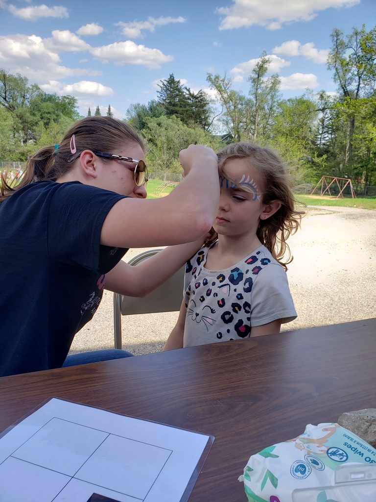 A+ face painting at the end of year outdoor family event.